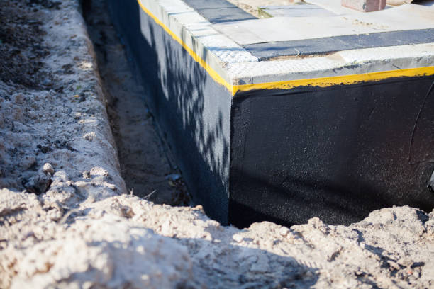 Professional Waterproofing technician working in Charlottesville, IN